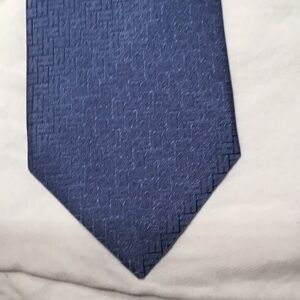 Classic Hermes Navy Blue Tie with Subtle Texture